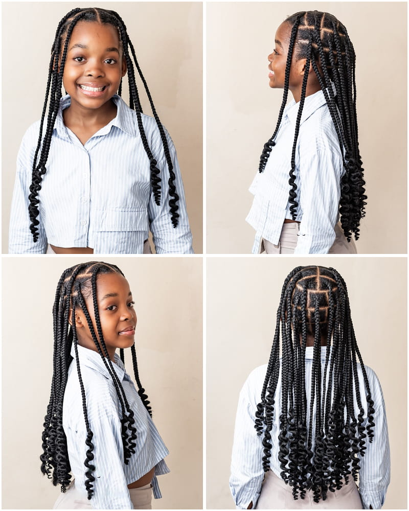 A 10 Year-Old Black Girl is Wearing Long Goddess Knotless Box Braids