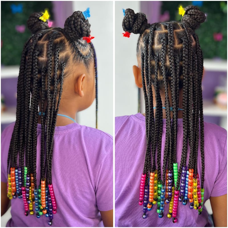 Cute African Girl Wearing Double Knotted Box Braids Hairstyle.