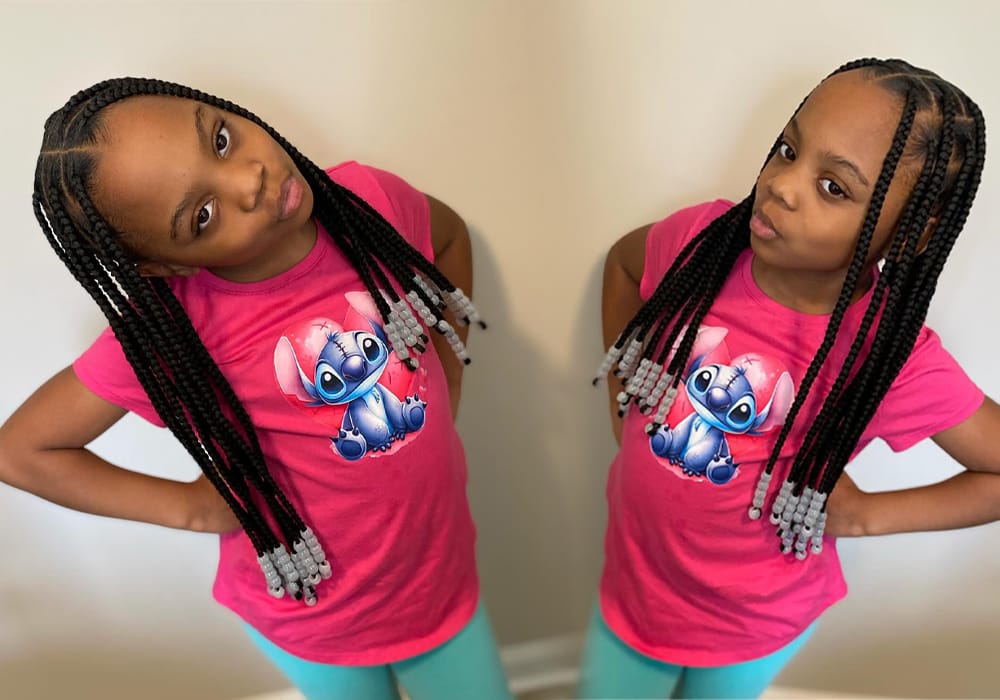 Cute African American Female Kid is Wearing beautiful Square-Shaped Box Braids. The Braids are adorned with lovely beads. The Image shows two angles of her hairstyle. 