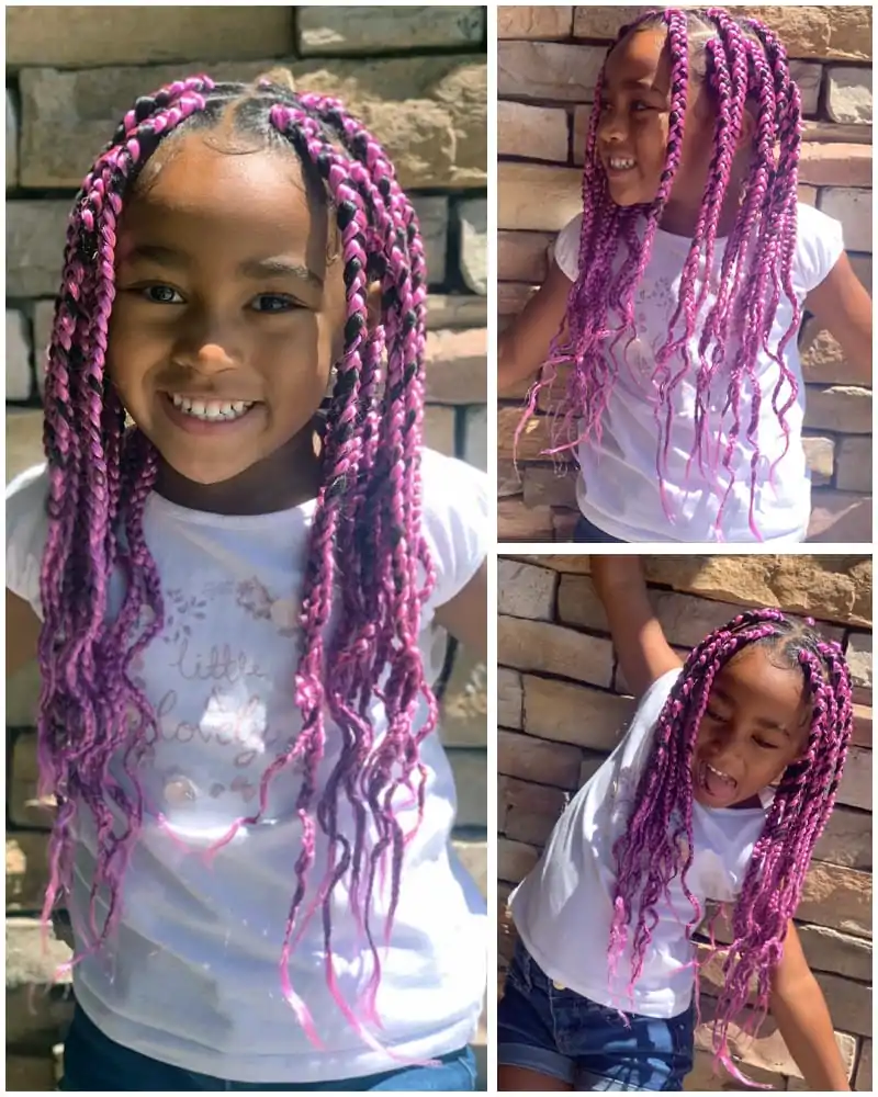 An African Kids of 8 Year is wearing a box braid style. Her braids are of rose pink color and black highlighted.