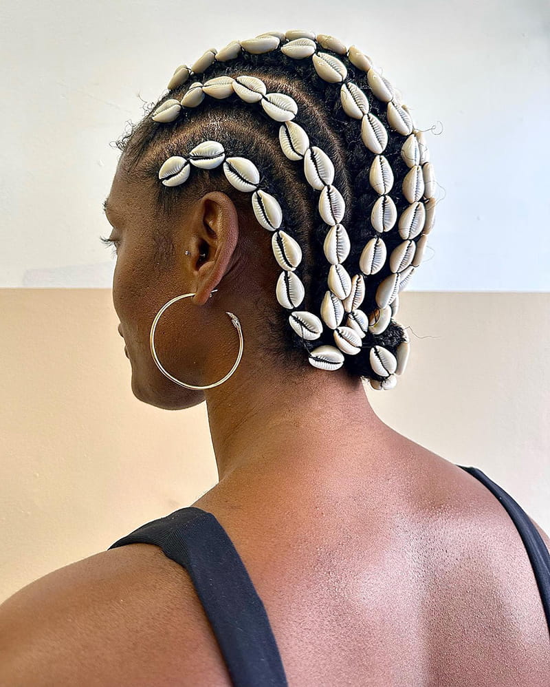 Braids with cowrie shell