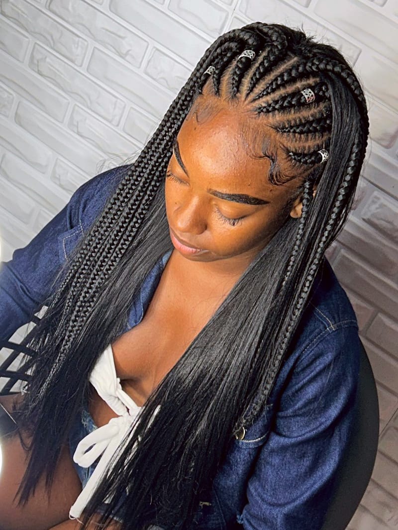 A woman wearing Fulani Goddess Braids with Curls and Hair Cuffs