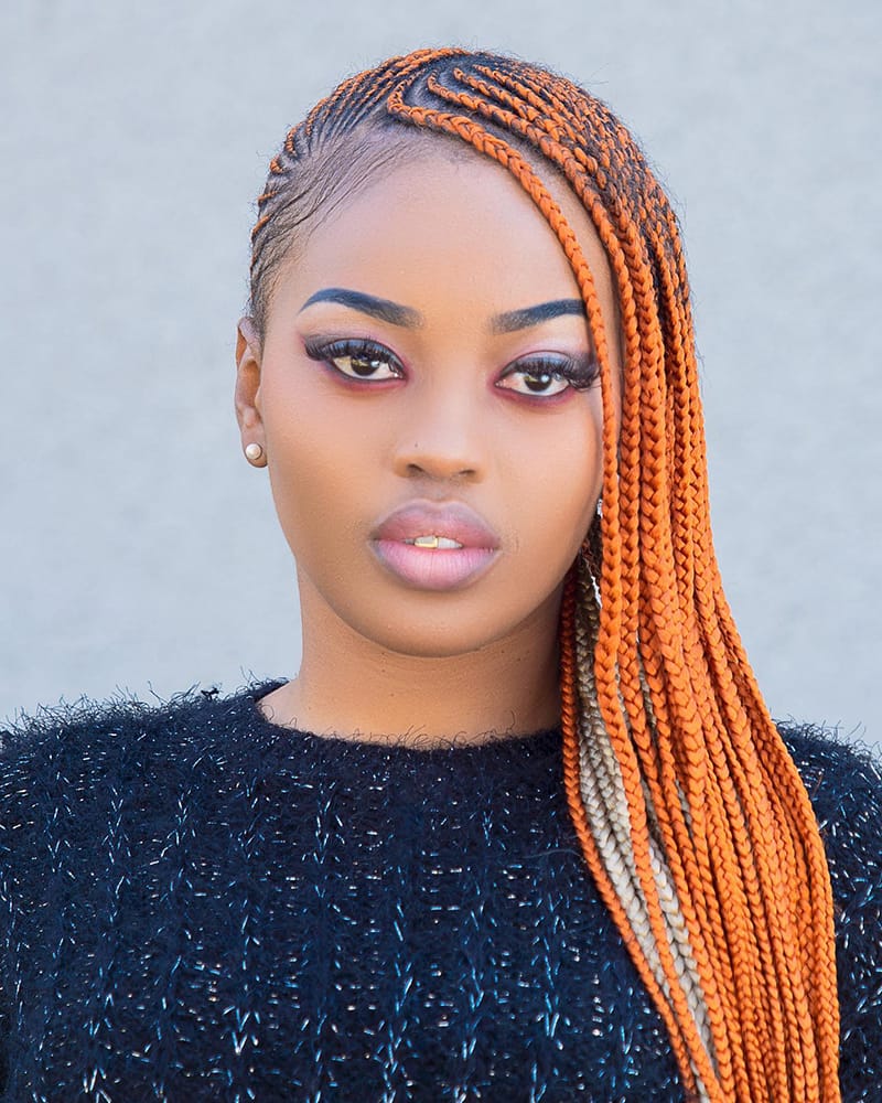 Woman Wearing Fulani Peekaboo Braids Hairstyle