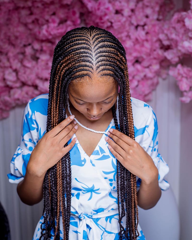 Woman Wearing Fulani Peekaboo Braids Hairstyle