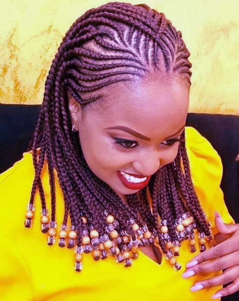 Woman wearing a combination of Fulani and Tribal Braids.