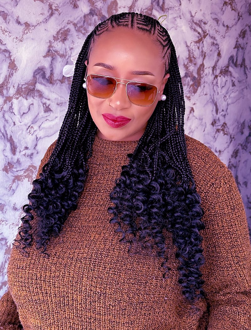 African American Woman Wearing a Braided Hairstyle. The Hairstyle combines the braids styles of Fulani and Bohemian.