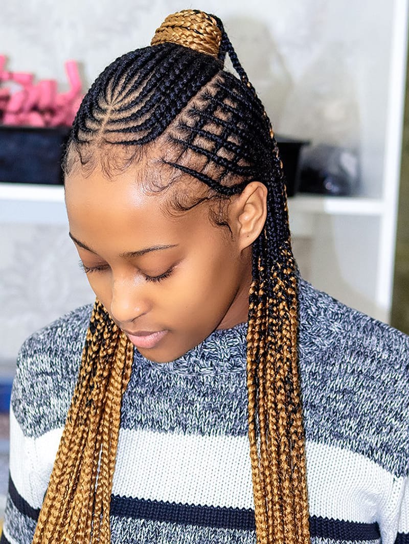 Woman wearing a combined Hairstyle of Braids, Fulani, Basket Wave and Ponytail. The Braids are blonde highlighted.