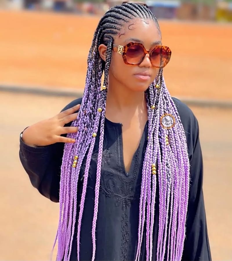 Woman wearing Black to Pink Ombre Braids.