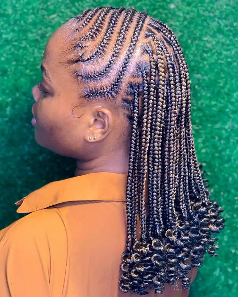 Back View of an African American Woman Wearing S-Curved Cornrows and Curls
