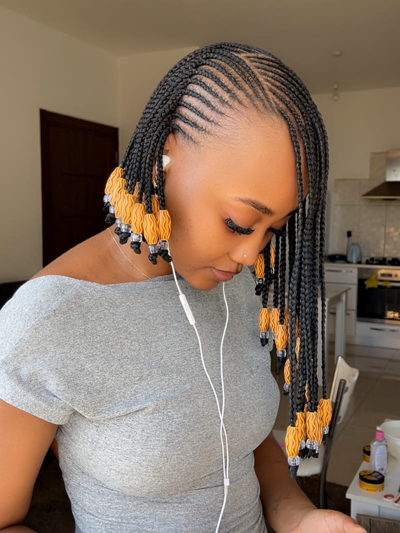 Side View of Asymmetrical Fulani Braids with a Deep Side Part