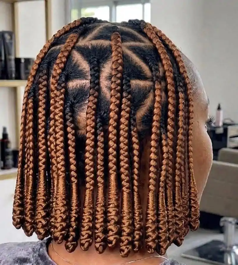 Auburn pixie braid bob with geometric parting and a short braided shape