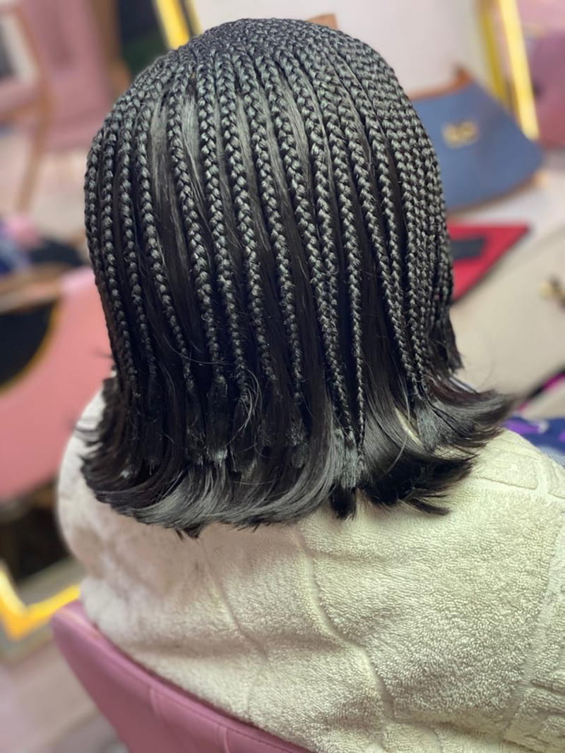 Layered micro cornrow bob with detailed short braided sections