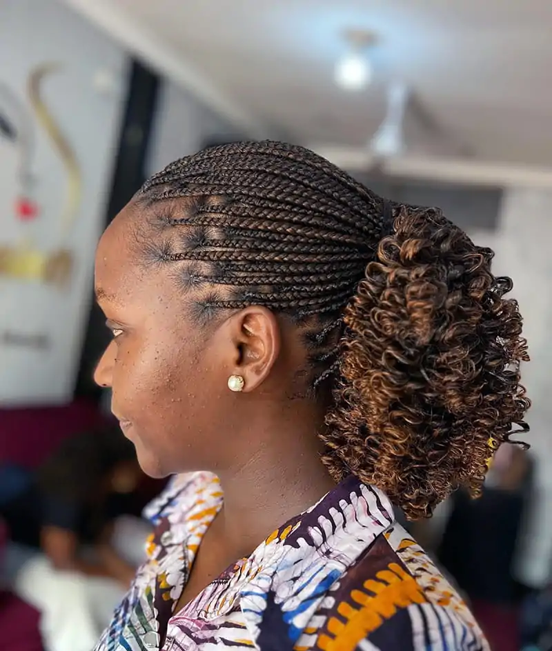Pixie braids styled with a curly ponytail for added texture