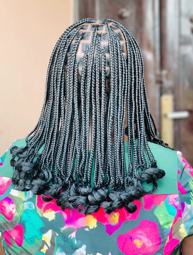 Small pixie braid bob with curled ends and compact braids